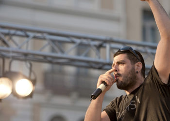 In this photo dated June 21, 2011, Greek rapper Pavlos Fyssas performs on stage. Fyssas, a hip-hop singer with the stage name Killah P and described as an anti-fascist activist, died early Wednesday Sept 18 from two stab wounds to the chest after leaving a cafe in the western area of Keratsini, Greece. Police arrested a suspect at the scene, who they say admitted to the killing and identified himself as a member of Golden Dawn. (AP Photo/John D. Carnessiotis)